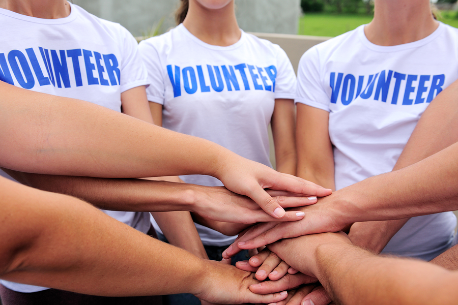 bigstock-volunteer-group-hands-together-15610862
